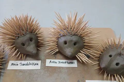 Clay hedgehogs displayed on a classroom table