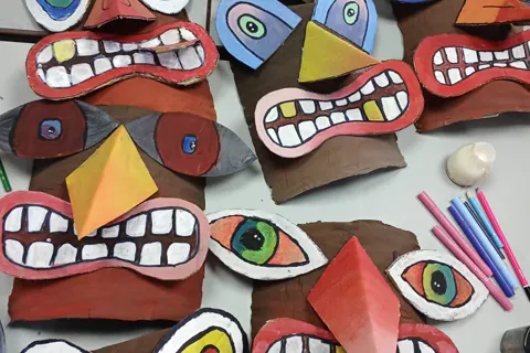 Colourful cardboard masks made by children