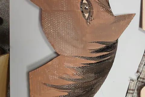 Painted cardboard bird artwork