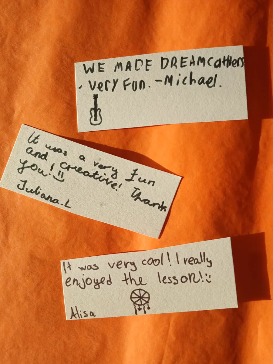 Three handwritten children's opinions saying the dreamcatcher lesson was fun, creative and enjoyable