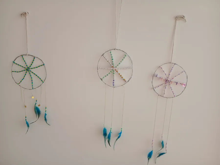 Three finished handmade dreamcatchers displayed together