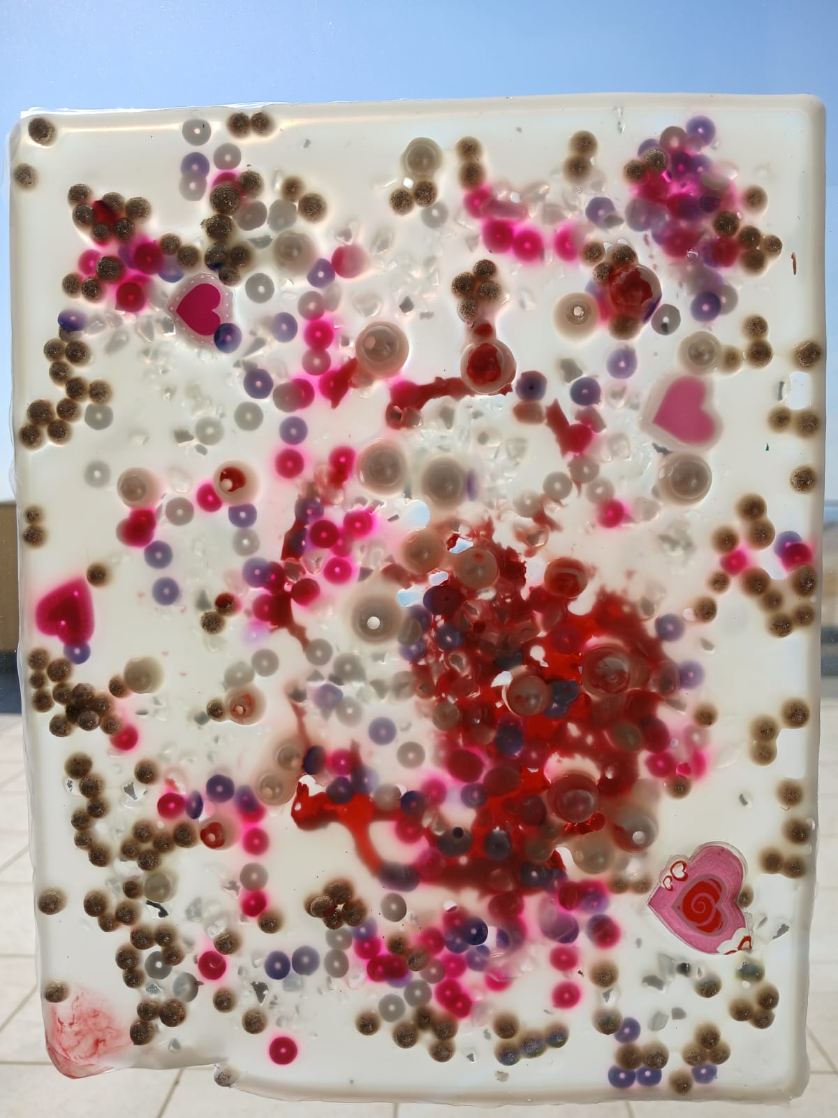 Sensory art panel with a heart pattern made from beads and buttons