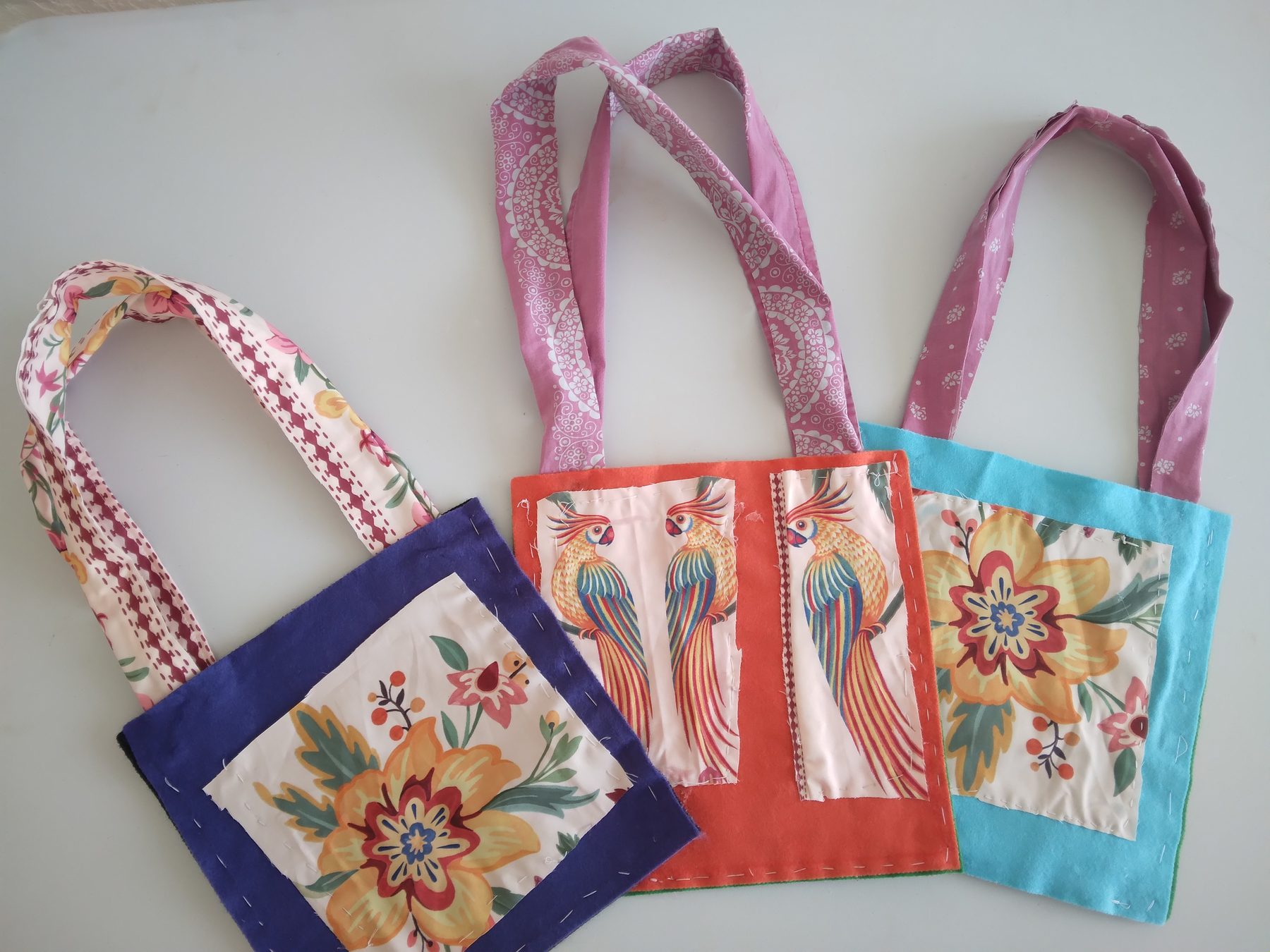 Purple, orange and turquoise handmade fabric bags